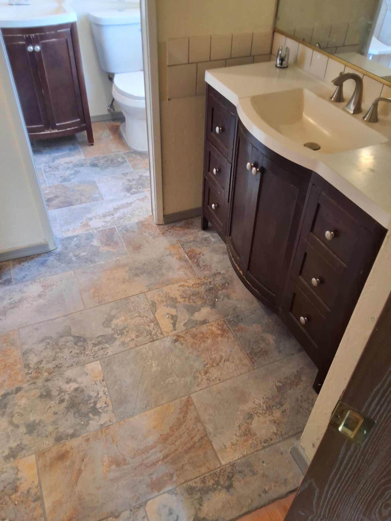 Updated bathroom vanity and tile flooring
