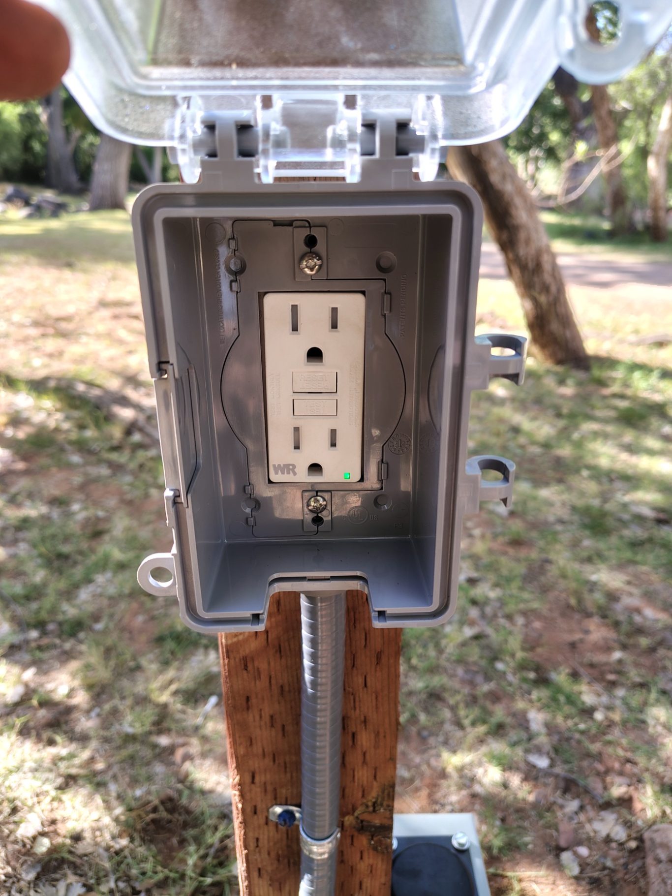 Outdoor GFCI outlet with weatherproof box.